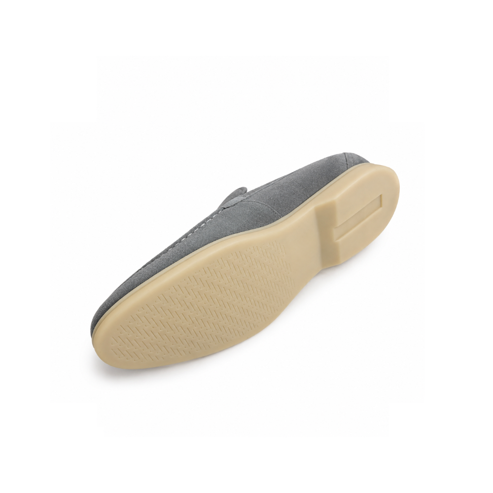 Gray shoe sole with beige rubber sole on a white background