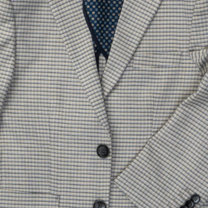 Close-up of a gray checkered blazer with a button