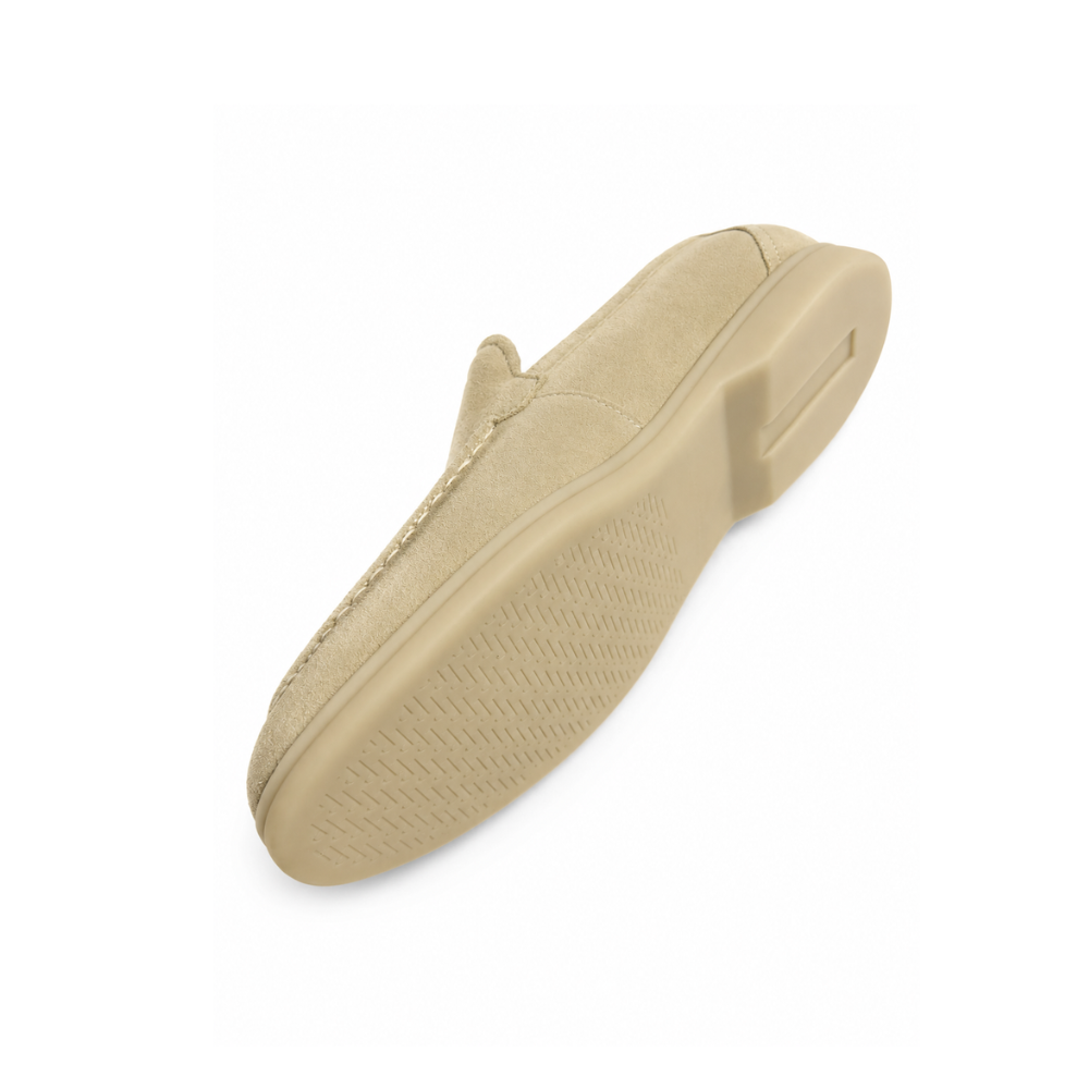 Beige slip-on shoe on a white background