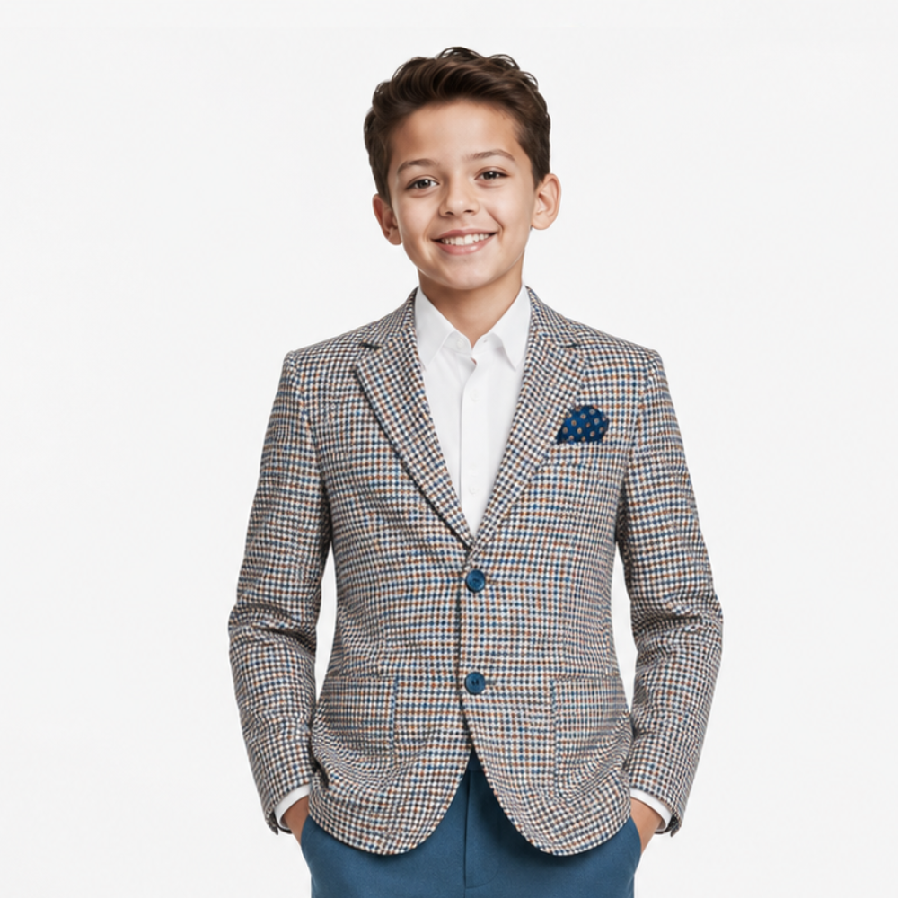 Young boy wearing a checkered blazer with a white shirt and blue pants on a white background