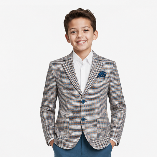 Young boy wearing a checkered blazer with a white shirt and blue pants on a white background