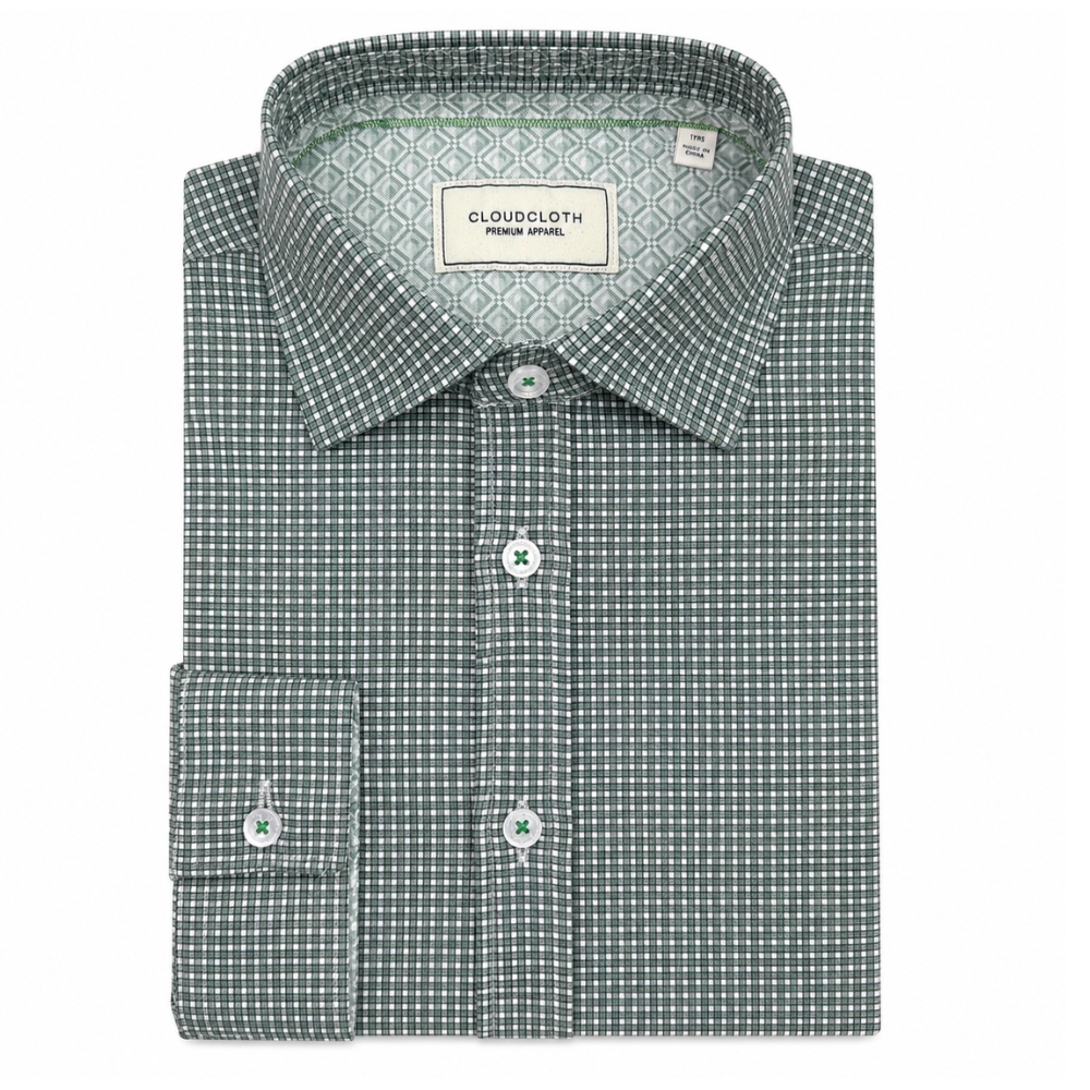 A folded men's dress shirt by Cloudcloth, featuring a green and white micro-check pattern, a classic collar, and a button-down front.