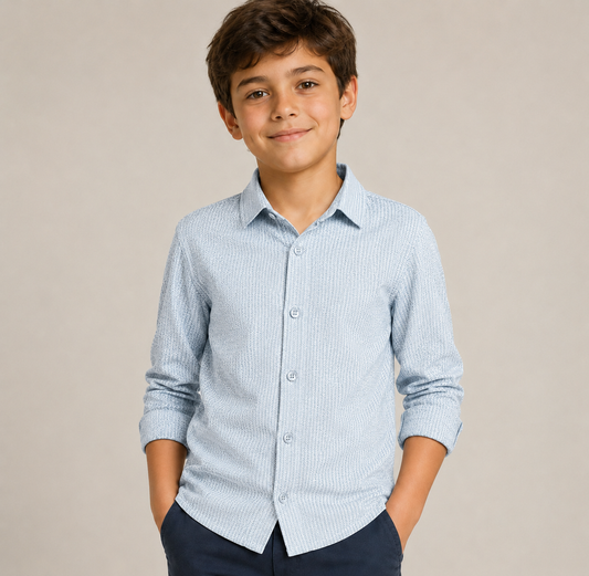 Young boy wearing a light blue striped shirt against a beige background