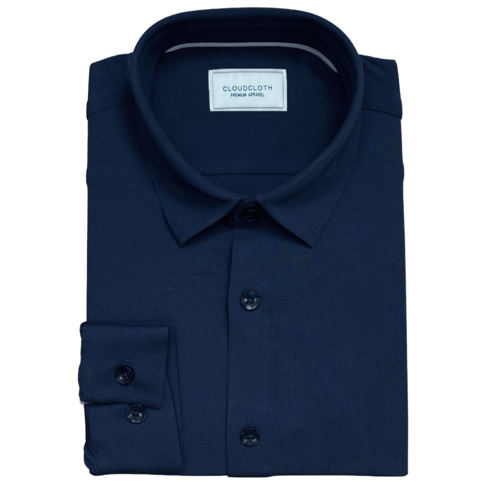 Folded navy blue shirt with CloudCloth label on a white background