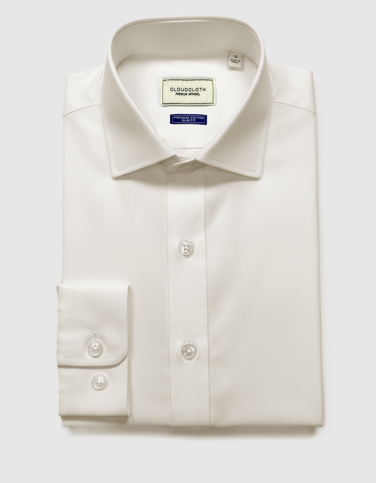 White dress shirt with collar label on a light gray background