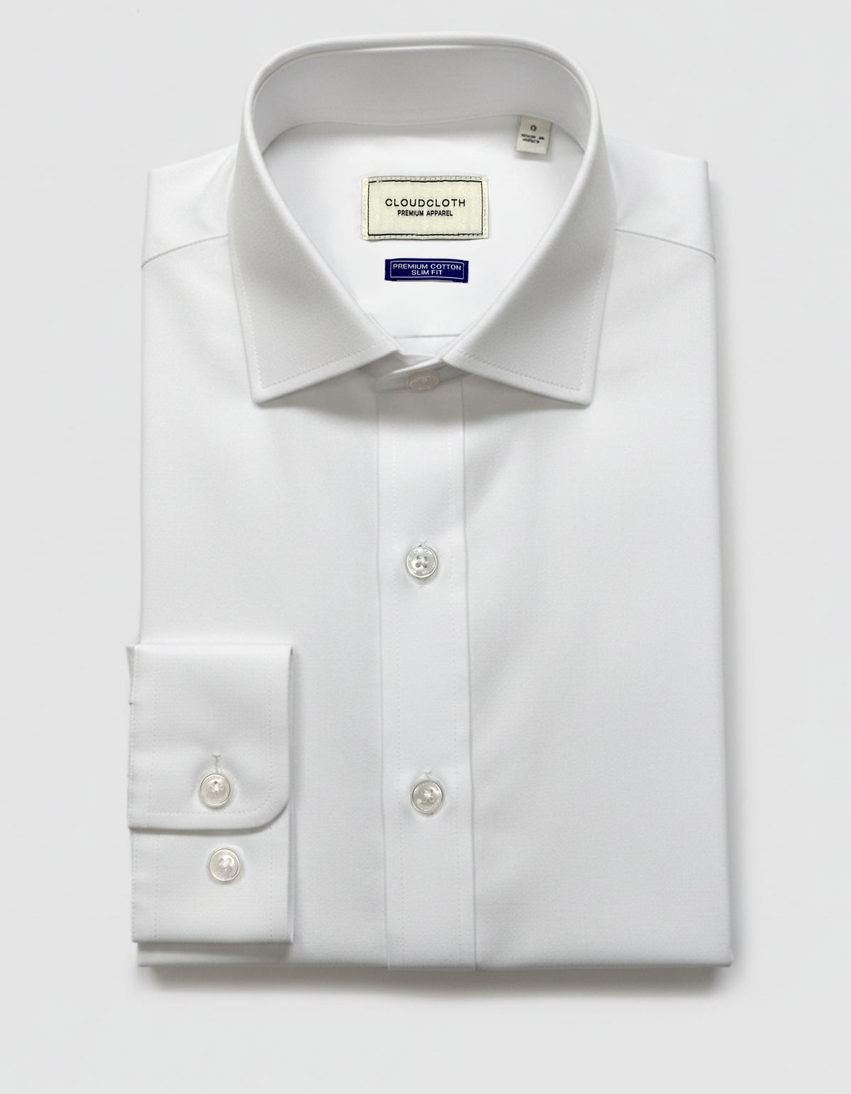 White dress shirt with a collar label on a light gray background