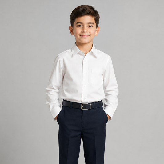 Young boy wearing a white dress shirt and navy pants on a gray background