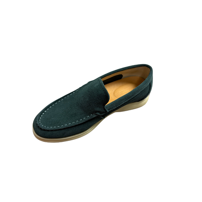 Green loafer shoe on a white background