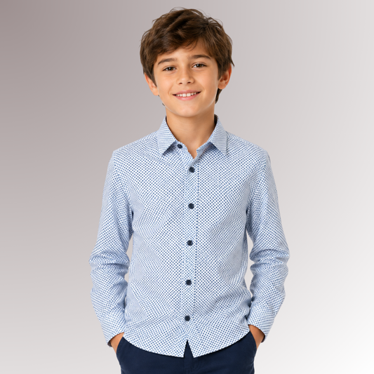 Young boy wearing a blue patterned shirt against a gray background