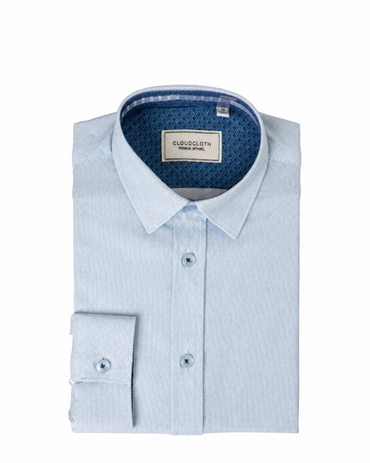 Light blue dress shirt with a patterned collar on a white background