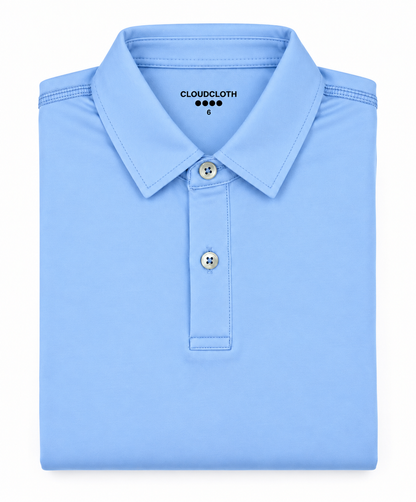 A folded light blue polo shirt on a plain white background, with the brand name CLOUDCLOTH visible inside the collar.