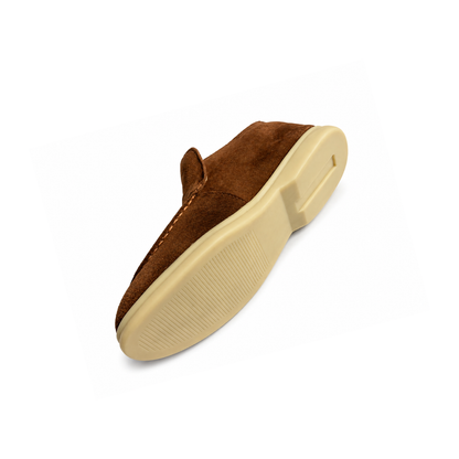 Brown slip-on shoe with beige sole on a white background