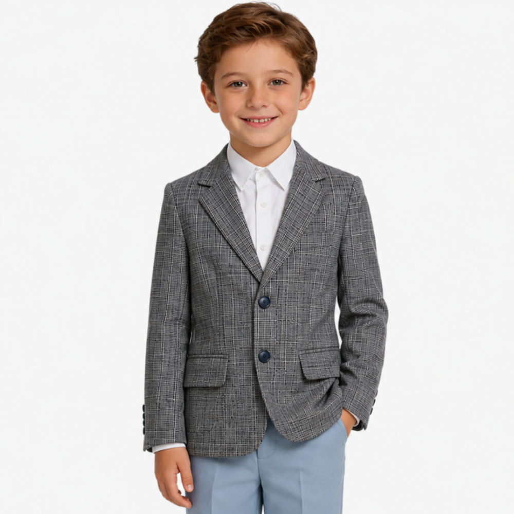 Child wearing a gray checkered blazer and light blue pants on a white background