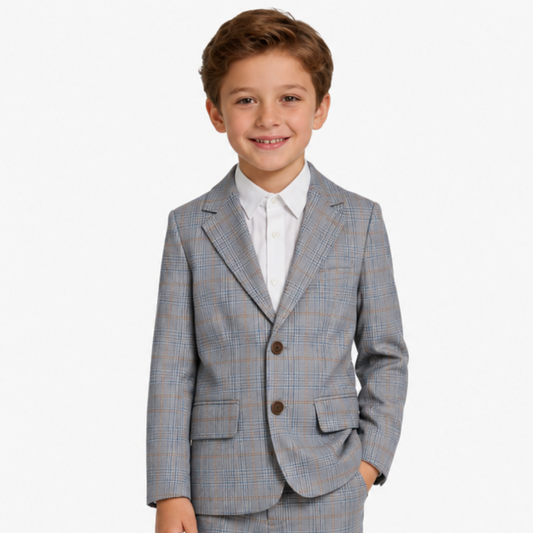 Young boy wearing a gray checkered suit with a white shirt on a white background