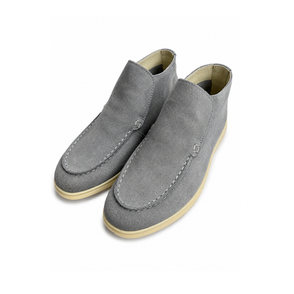 Pair of gray suede shoes on a white background