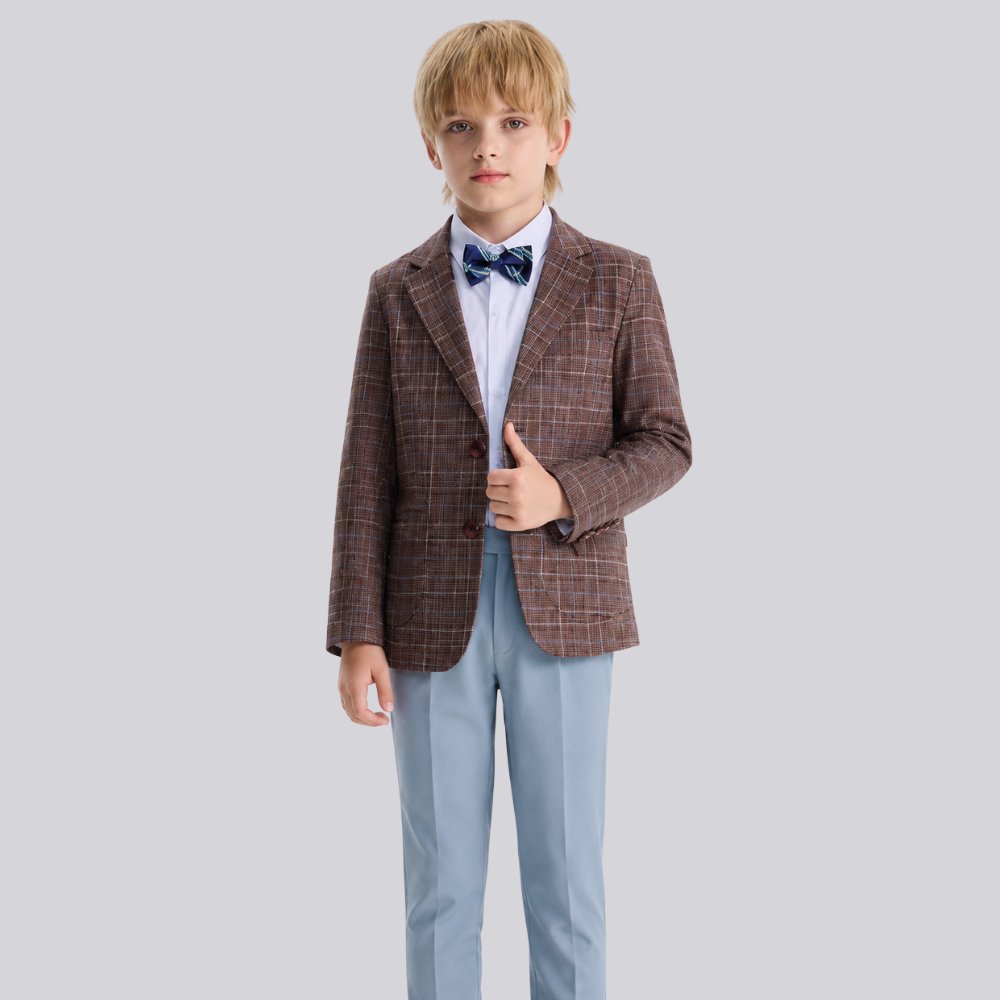 Child wearing a brown checkered blazer, white shirt, and blue bow tie on a light gray background