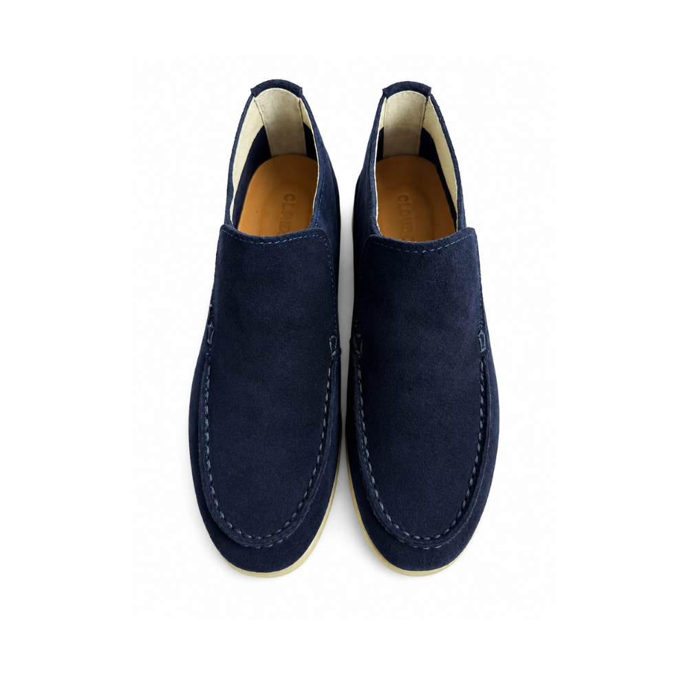 Pair of navy blue loafers on a white background
