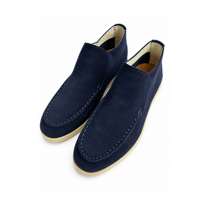Pair of navy blue loafers on a white background