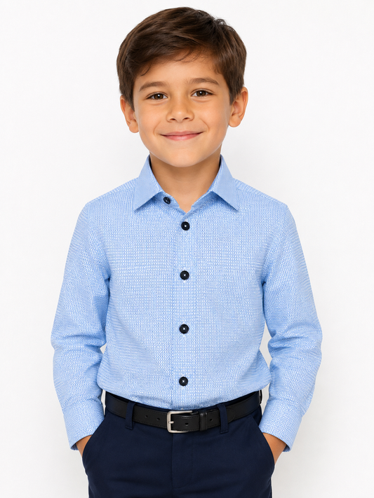 A young boy wearing a light blue long-sleeve button-down shirt with a subtle textured pattern, paired with navy pants and a black belt, photographed against a clean white background.