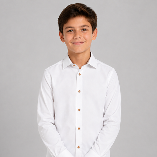 Young boy wearing a white dress shirt with brown buttons on a gray background