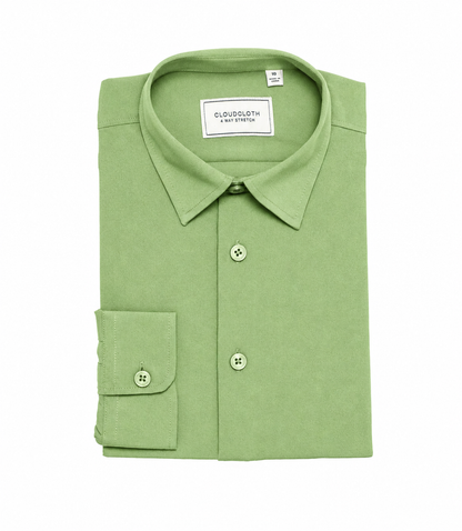 A folded light green long-sleeve dress shirt with a pointed collar, three-button placket, and a single-button cuff, shown on a plain white background. The brand label reads 'CLOUDSLOTH & SMITH'.