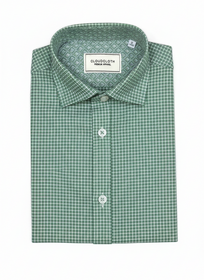 A folded men's dress shirt by Cloudcloth in a green and white micro-check pattern, displayed on a clean white background.
